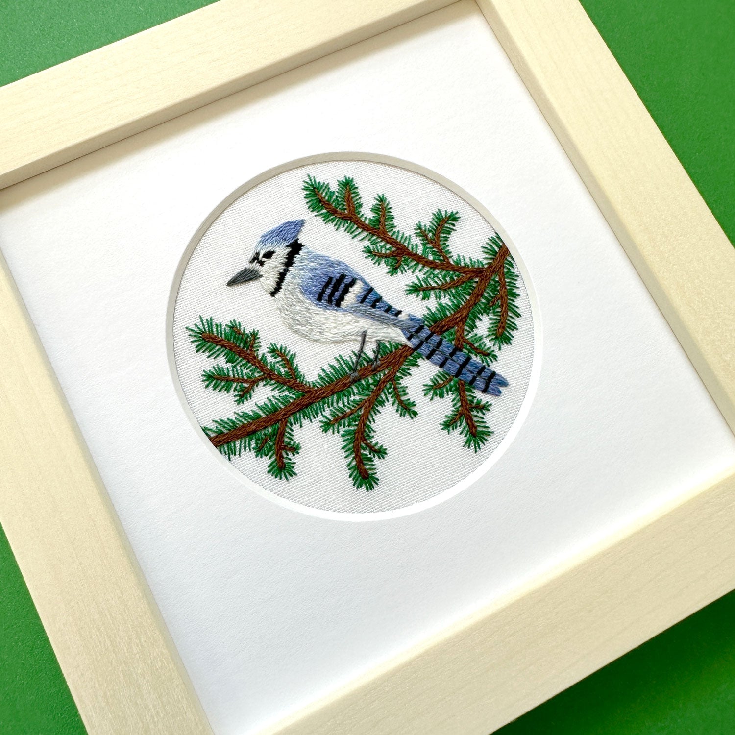 Blue Jay and Pine Branches on White Linen Hand Embroidered Art