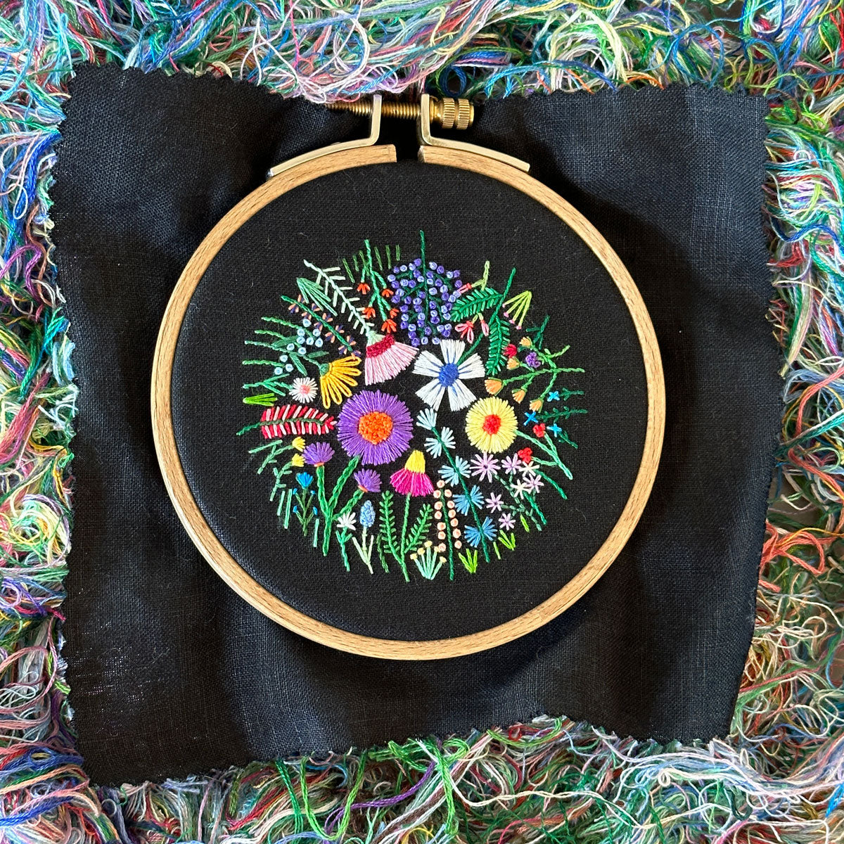 Rainbow Flowers C (2.75" Circle) on Black Linen Hand Embroidered Art