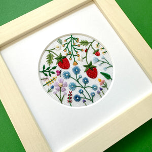 Spring Scene with Strawberries, Insects, and Flowers on White Linen Hand Embroidered Art