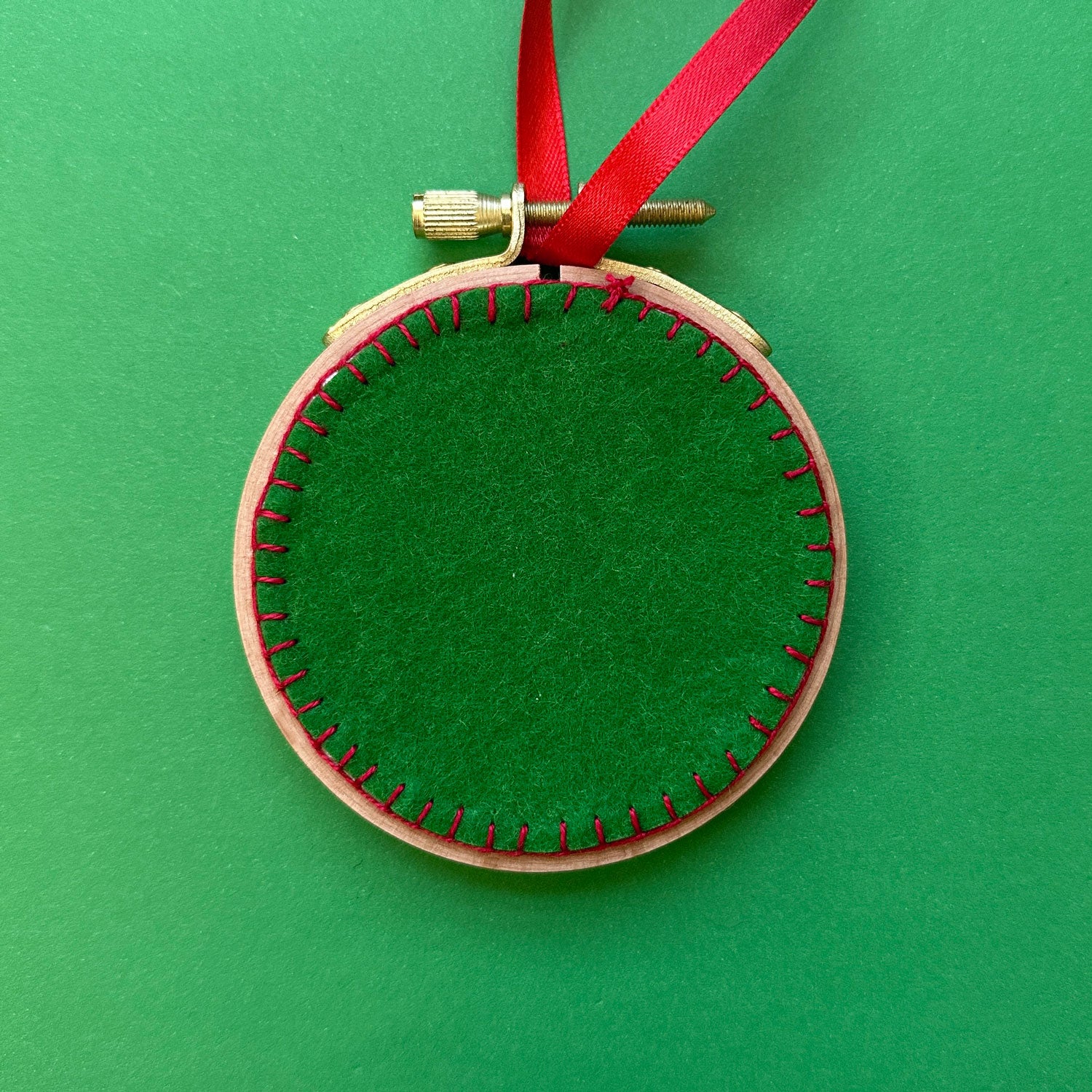 Embroidered Ornament D - Green and Red Snowflake on White Linen