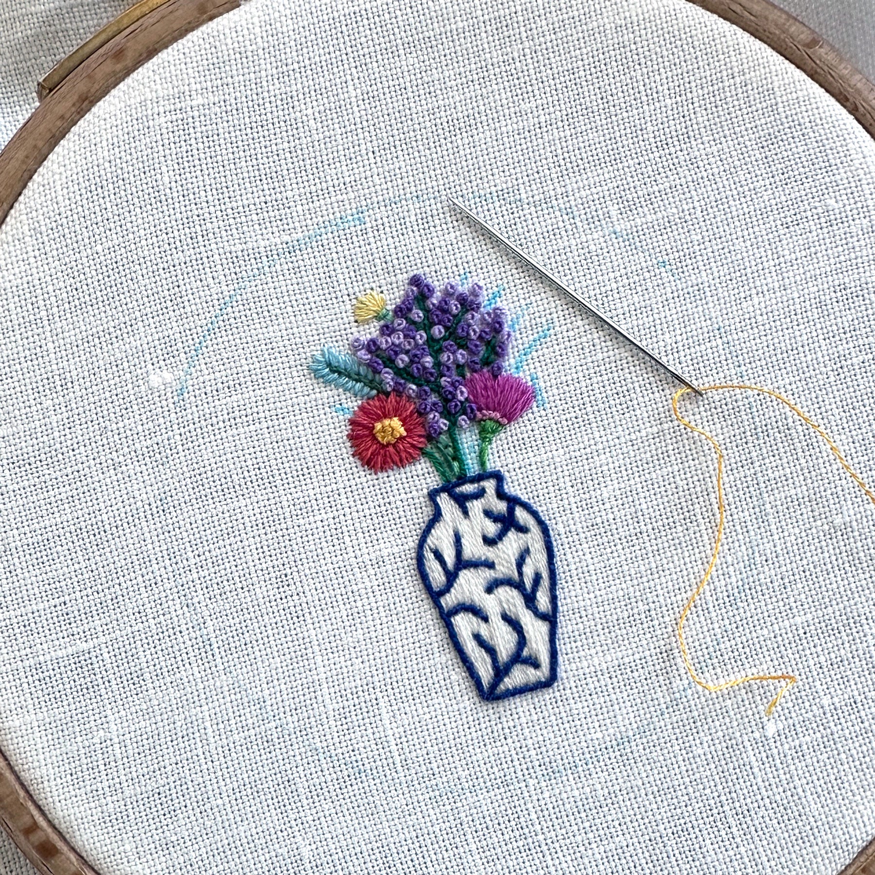 Rainbow Flowers in Blue and White Vase on White Linen Hand Embroidered Art