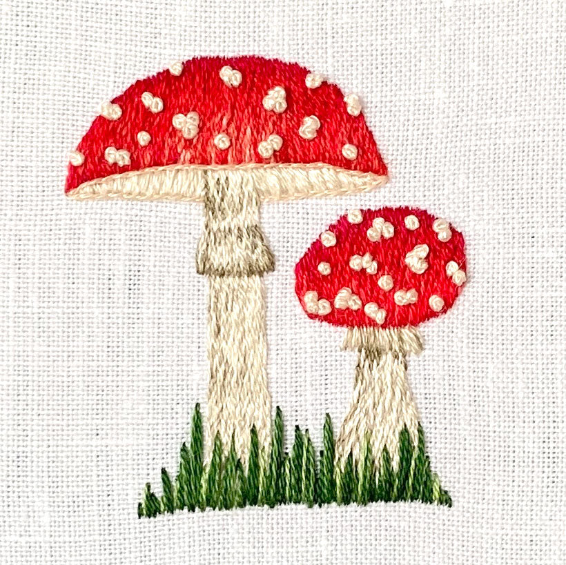 Two Amanita muscaria Mushrooms on White Linen Hand Embroidered Art
