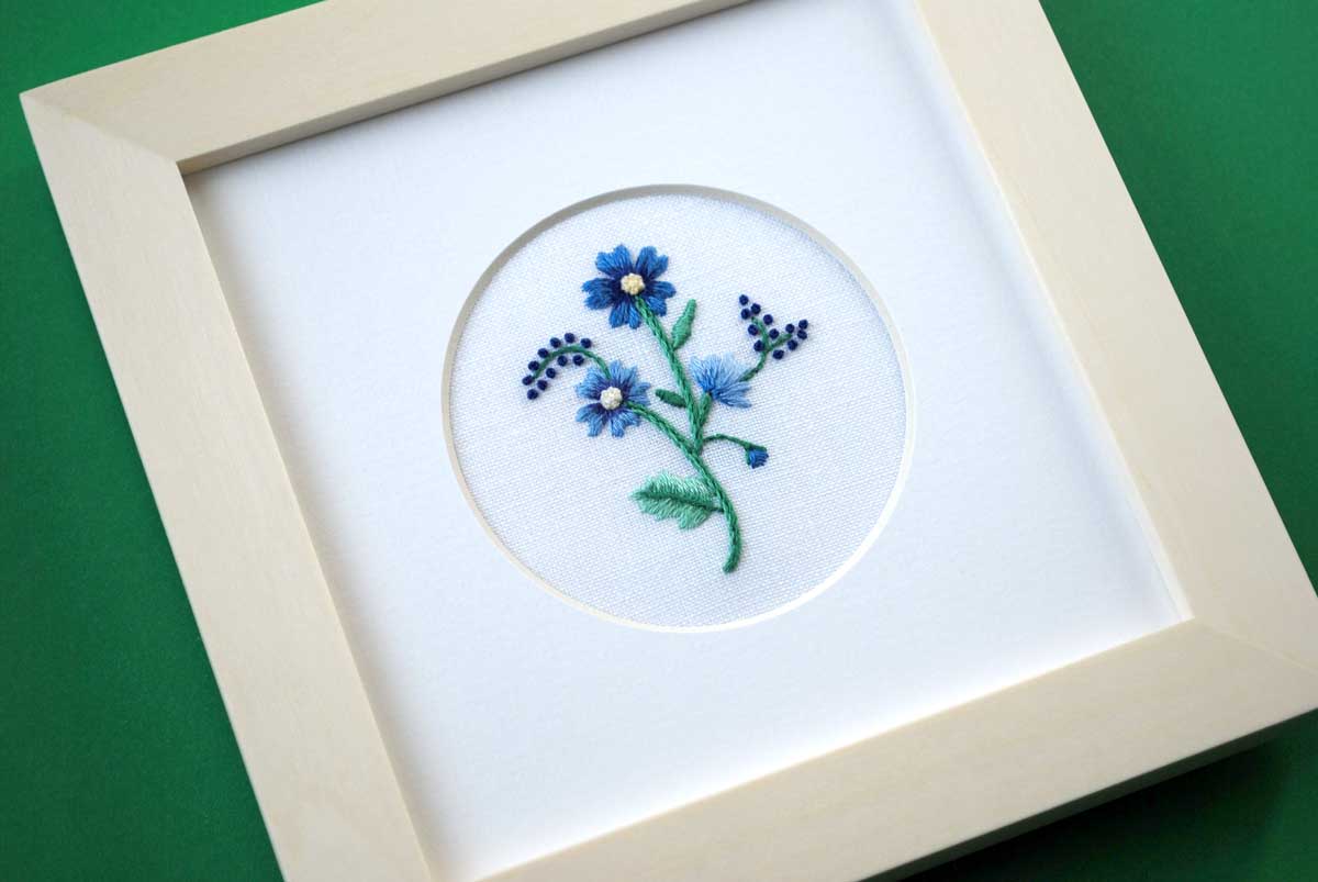 Single Flower (Blue) on White Linen Hand Embroidered Art