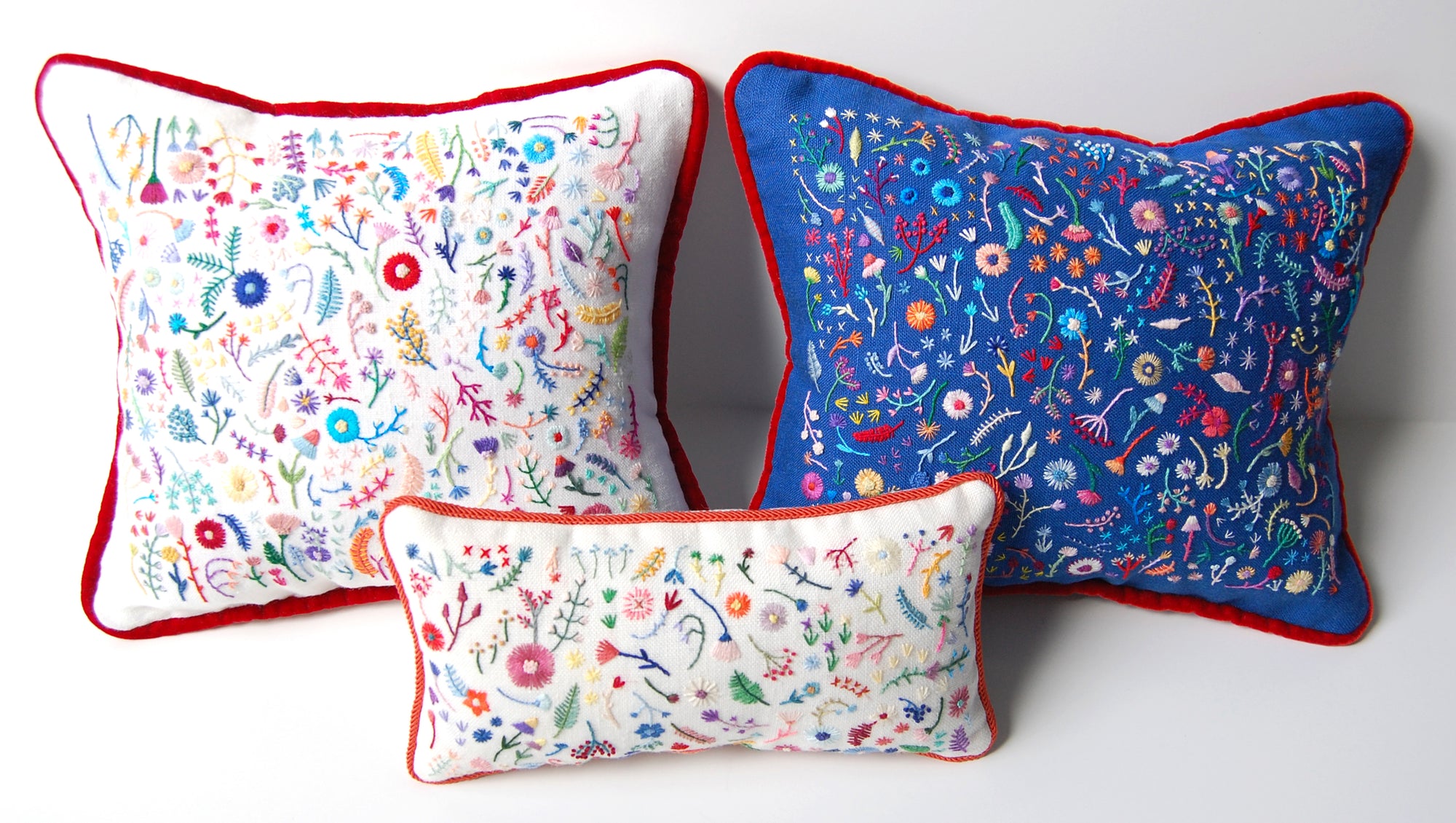 Hand Embroidered Rainbow Flowers Pillow with Red Trim