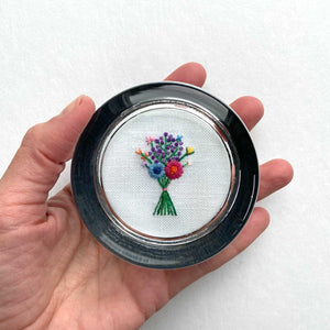 Bouquet with Purple Buds on White Linen Hand Embroidered Paperweight