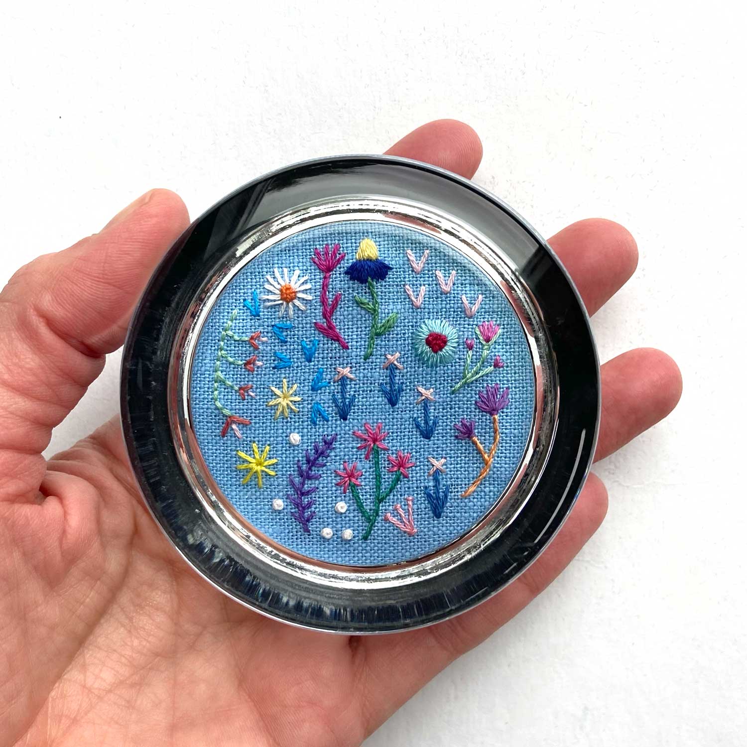 Rainbow Flowers on Blue Linen Hand Embroidered Paperweight