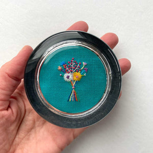 Bouquet with Pink Buds on Turquoise Linen Hand Embroidered Paperweight