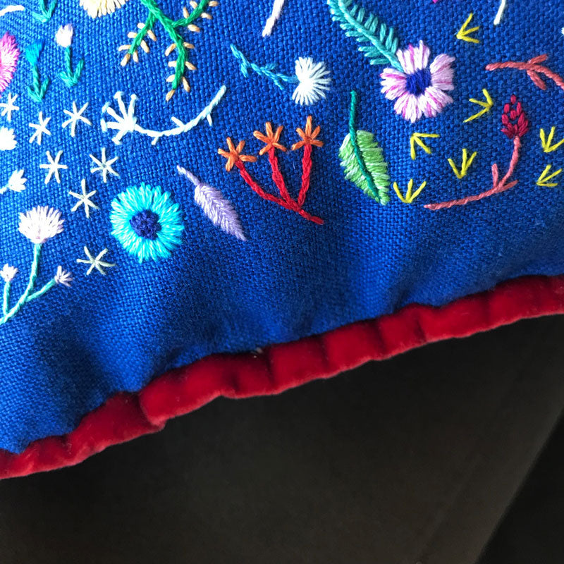 Hand Embroidered Rainbow Flowers Pillow on Blue Linen with Red Trim